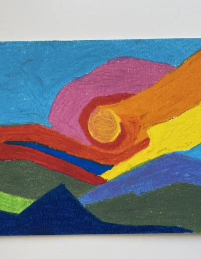 Hurricane sunset— spiral bands rotate around a fiery core, then unfurl sending ribbons across the sky, and tracing the edges of the mountains, already bathed in shadow.