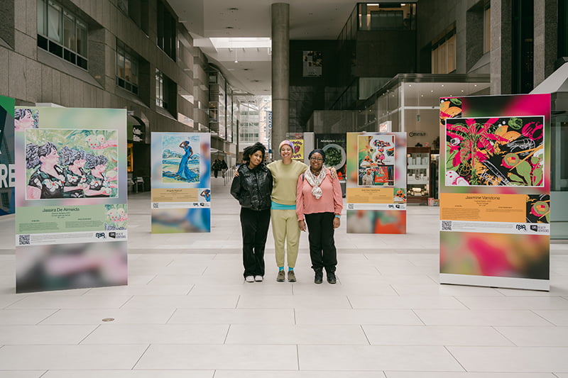 Northbound Exhibit, Jassira, Jasmine, and Angela in the middle of their exhibited artworks.